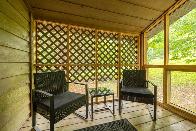 Screened in cabin porch.