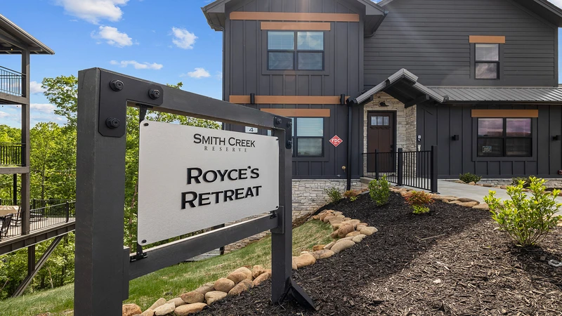 Sign in front of Royce's Retreat, your 6 bedroom cabin rental in the Smoky Mountains of Tennessee.