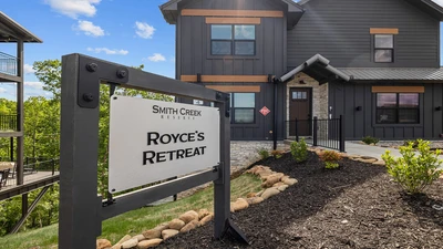 Sign in front of Royce's Retreat, your 6 bedroom cabin rental in the Smoky Mountains of Tennessee.