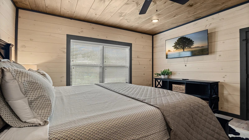 Your cabin's second bedroom with TV.
