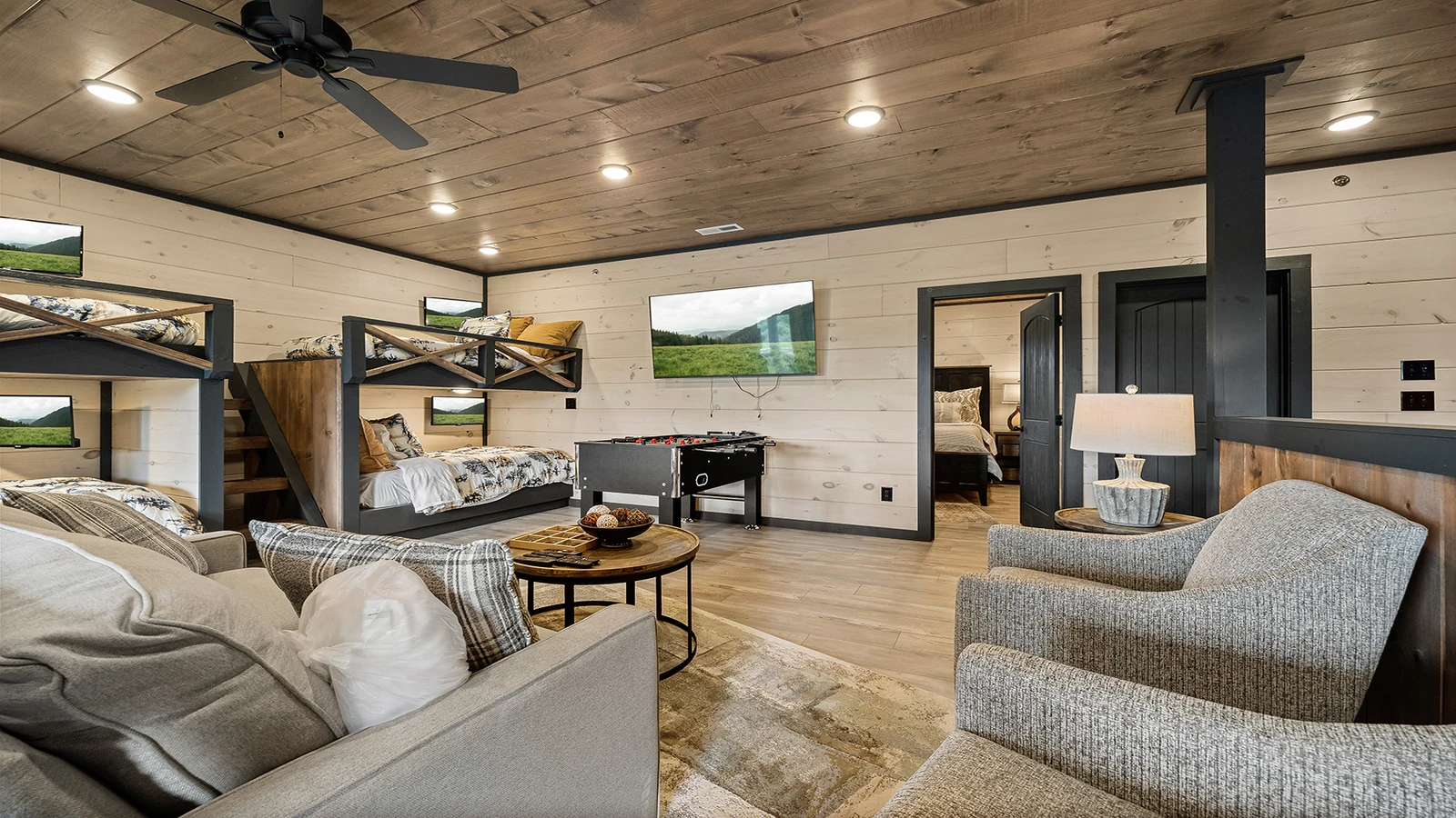 Seating in your cabin's game room with large screen TV.