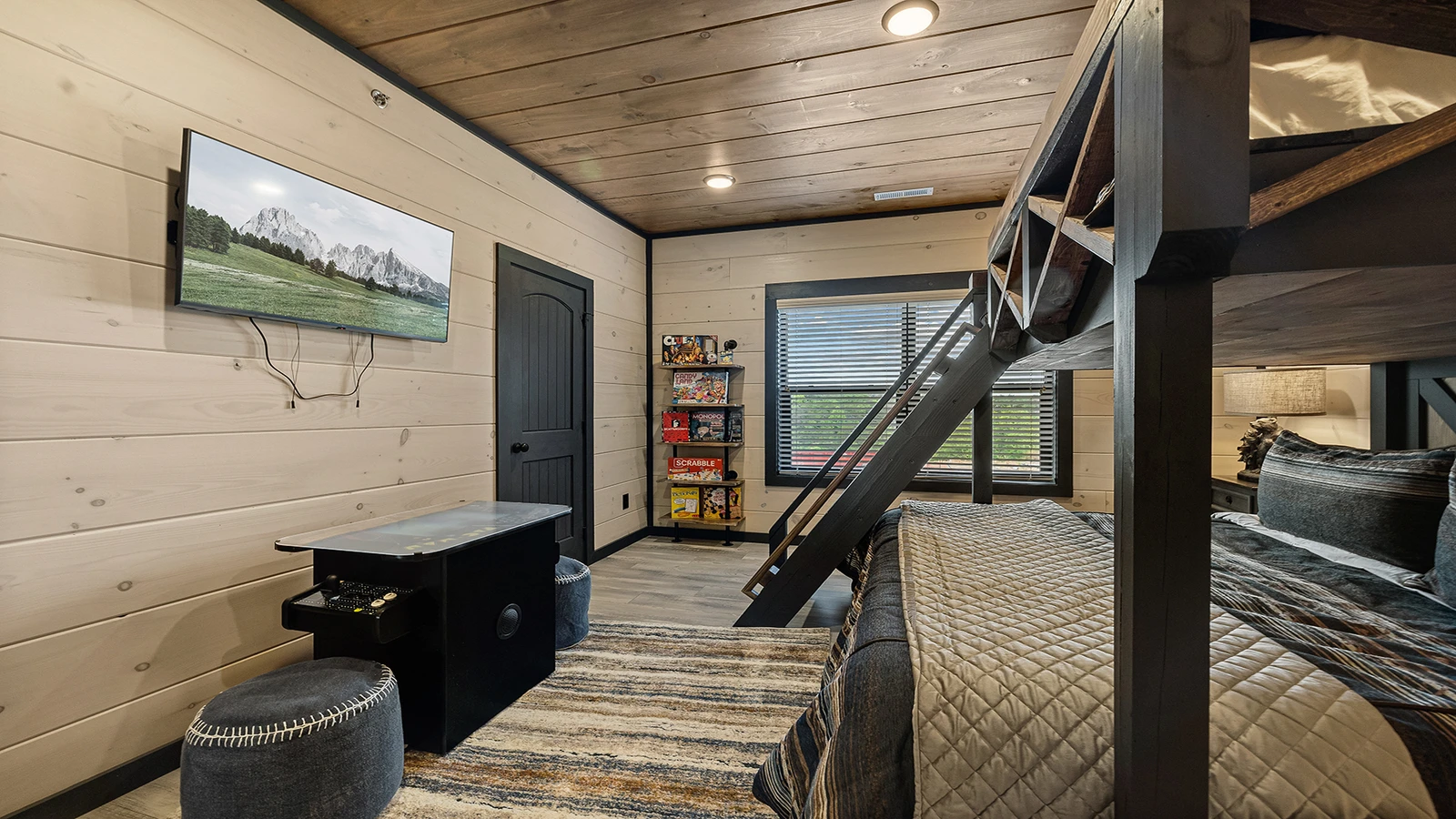 Bedroom with large screen TV.