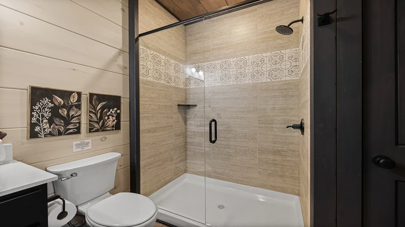 Your cabin's lavish full bath with walk-in showr.