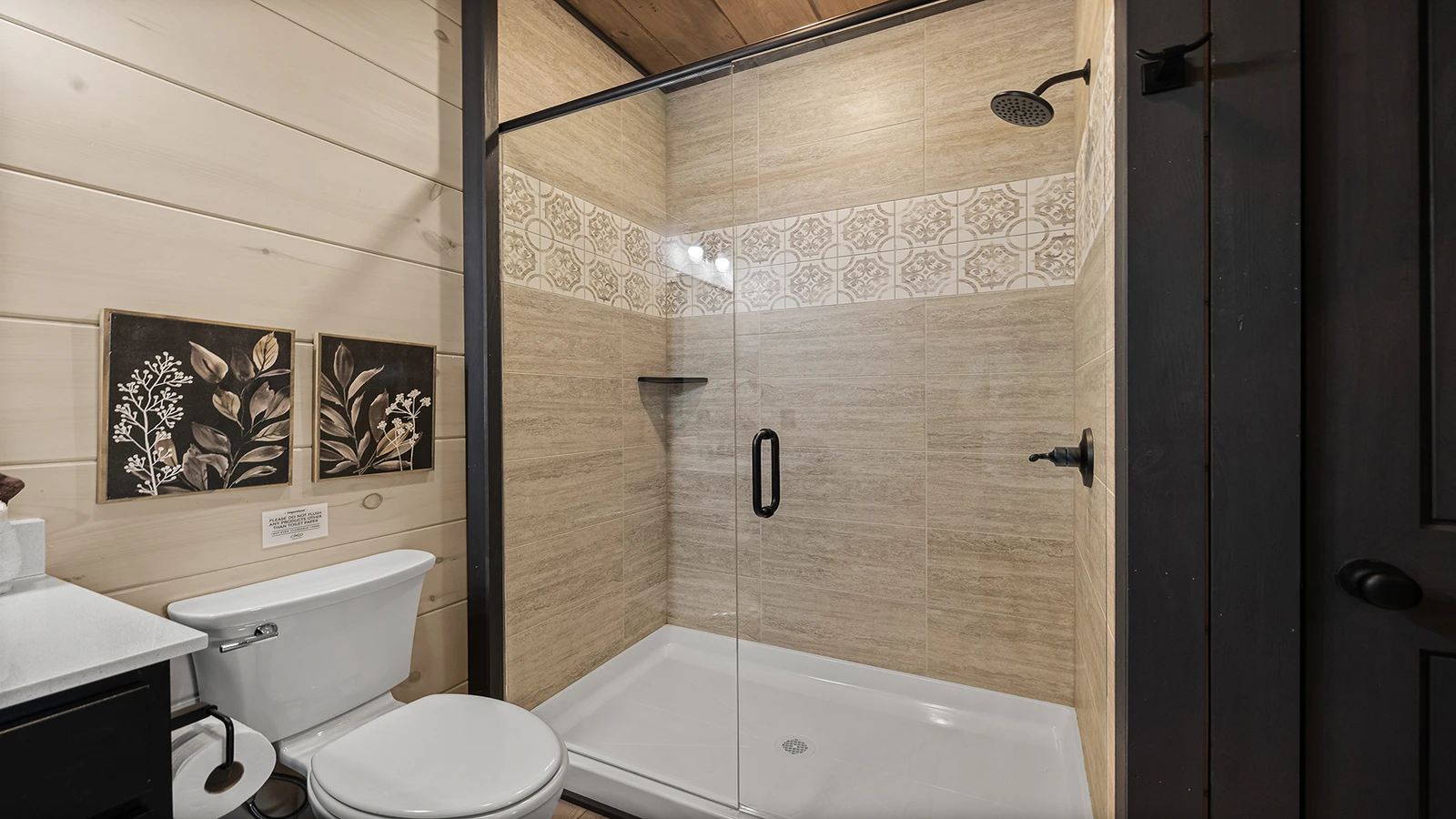Your cabin's lavish full bath with walk-in showr.