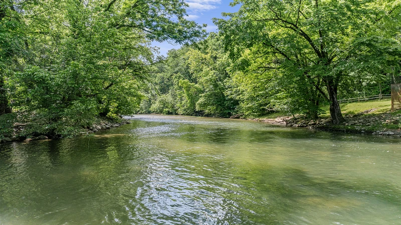 Little Pigeon River as it gently flows past River Bend in Pigeon Forge.