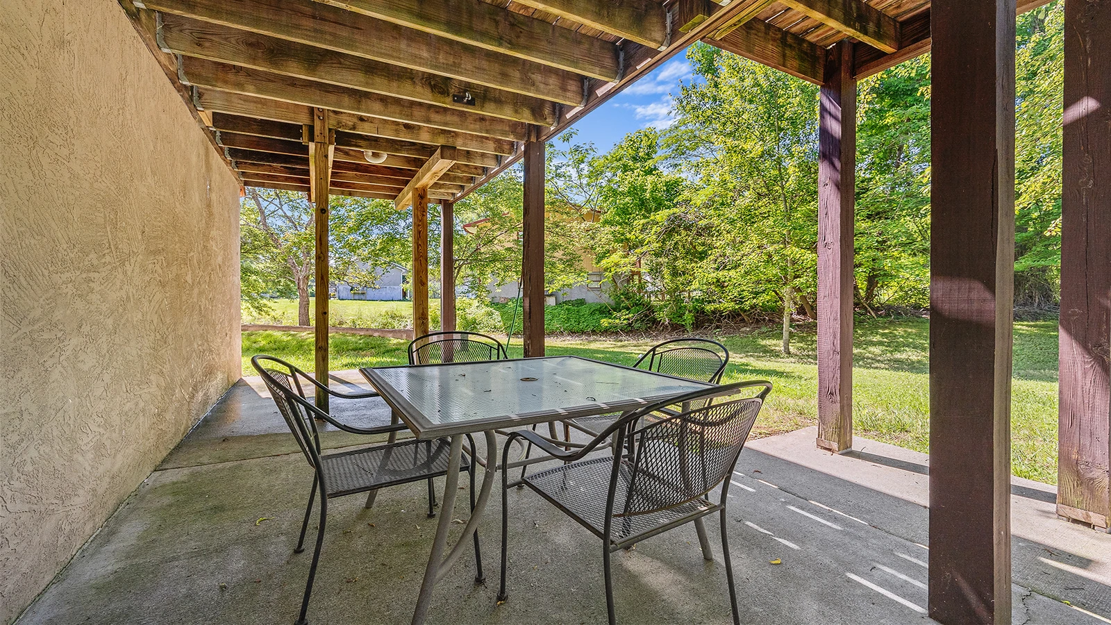 The family can enjoy meals on the outdoors table.