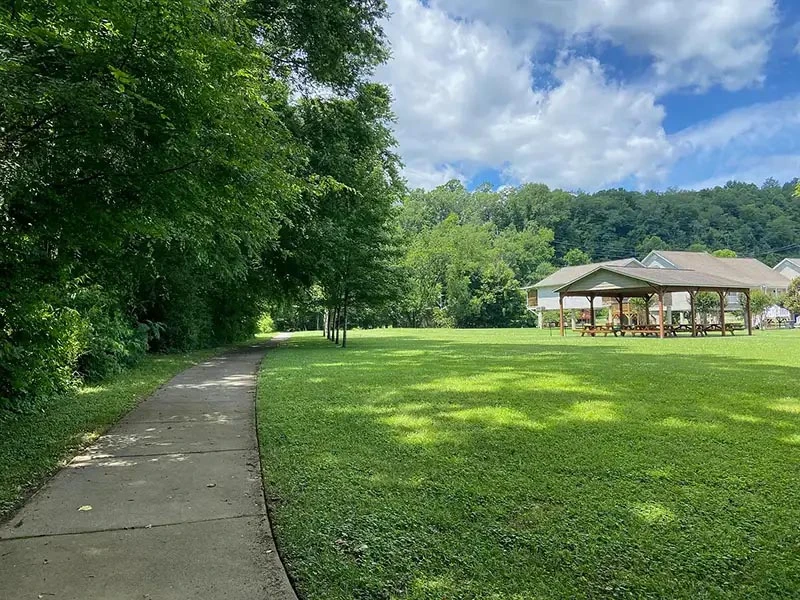 Enjoy somber moments together walking along the paved trail by the Little Pigeon River.
