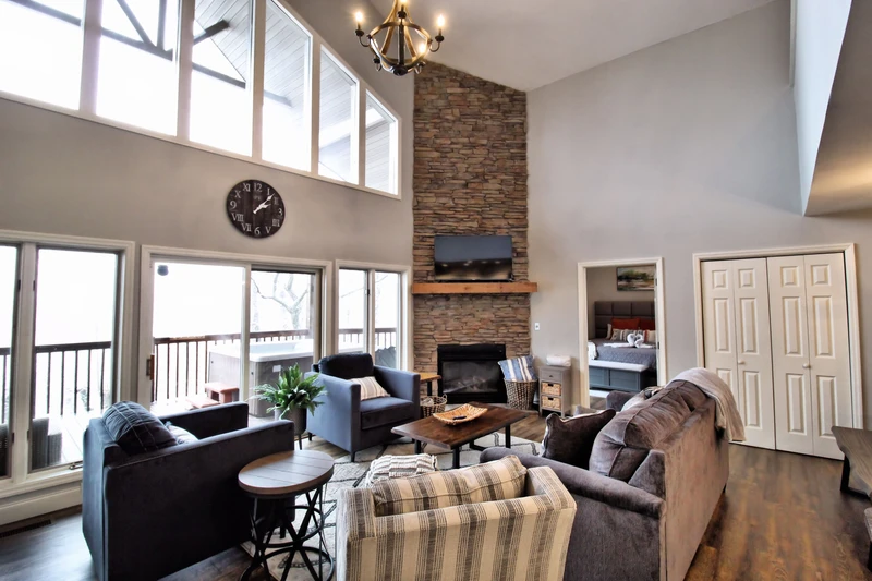 Large cabin windows bring the Smoky Mountains indoors.