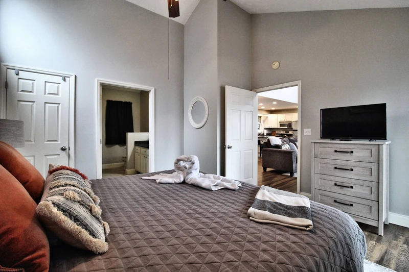 King sized bed with television.