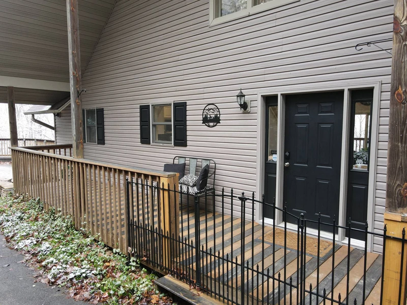 Side porch for stepping out and listening to nature.