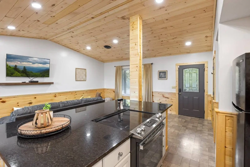 Cabin's kitchen island providing extra seating for family meals.