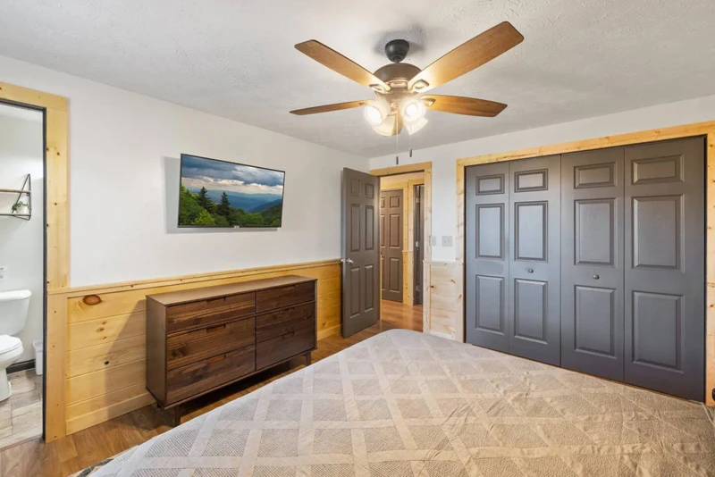 Accommodating cabin bedroom with television.