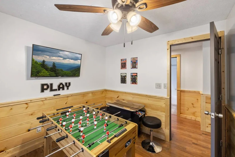 Watch television while enjoying games of foosball.