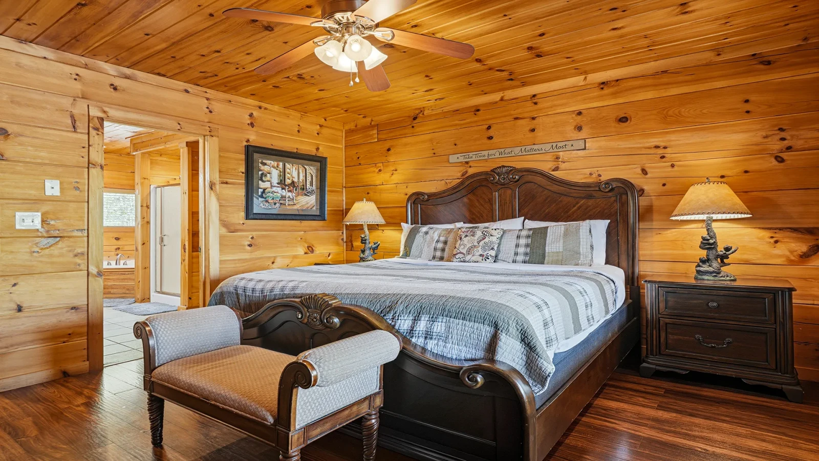 King Bed  and seating at your rental cabin's master bedroom. 