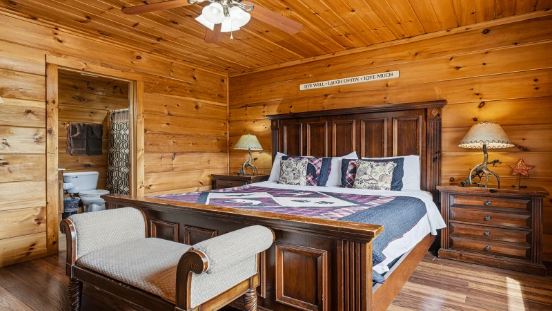 Large bedroom with seating, tv and full bath.
