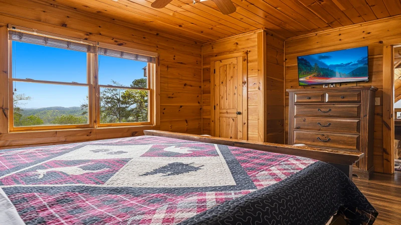 Second bedroom with king bed, tv and full bath.
