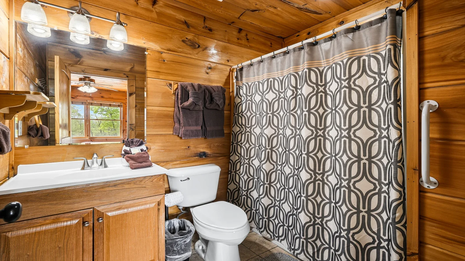Your cabin's second bedroom with full bath.