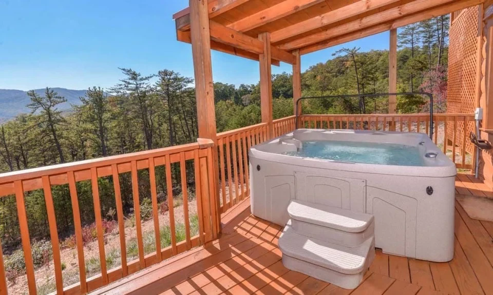 Take in the scenic Smoky Mountains from your rental cabin's large hot tub. 