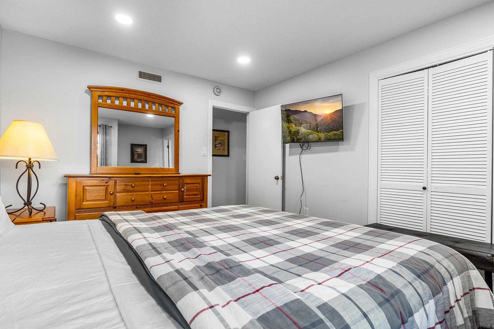 Watch favorite shows while relaxing in your king bed.