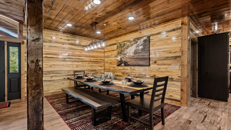 Your cabin's large dining table offers a touch of rustic charm mixed with large capacity seating.