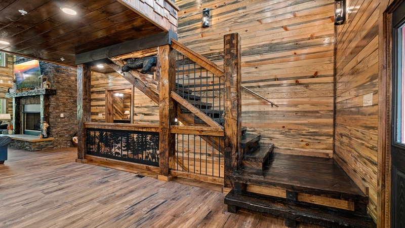 The grand stairway takes you upstairs to two large bedrooms.