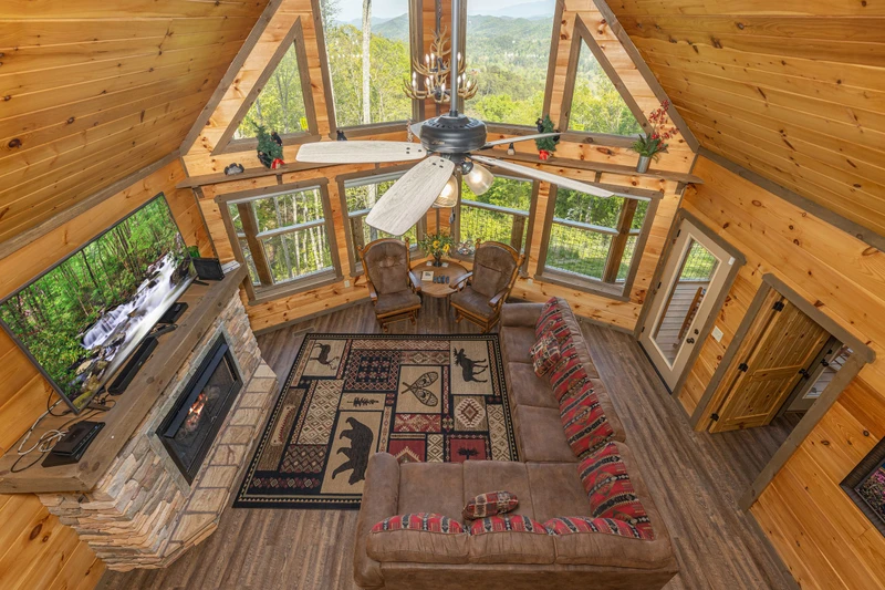 View of the rental cabin's living room from the loft.