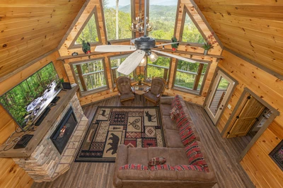 View of the rental cabin's living room from the loft.