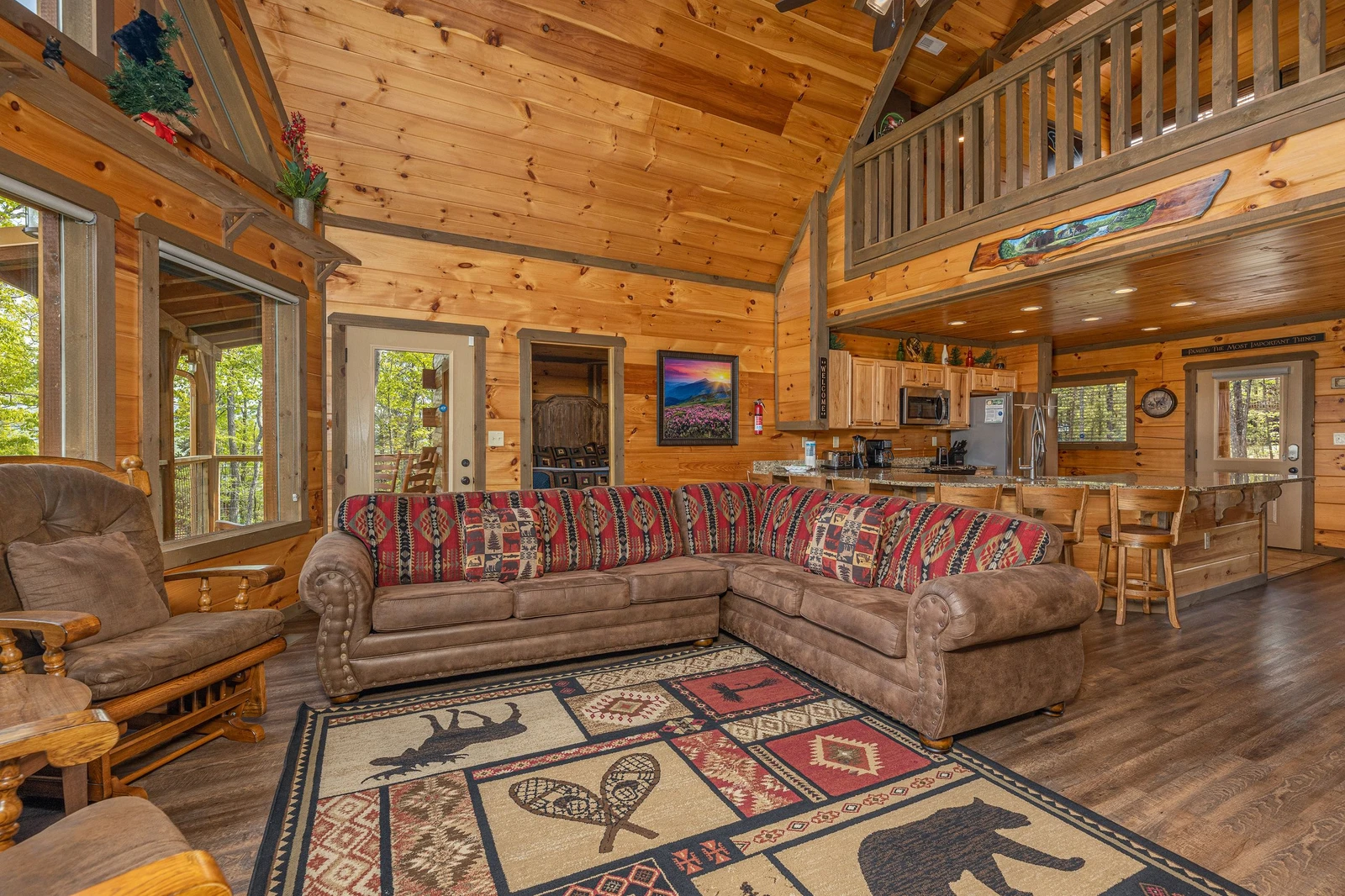 Cabin's living room seating towards the open kitchen.