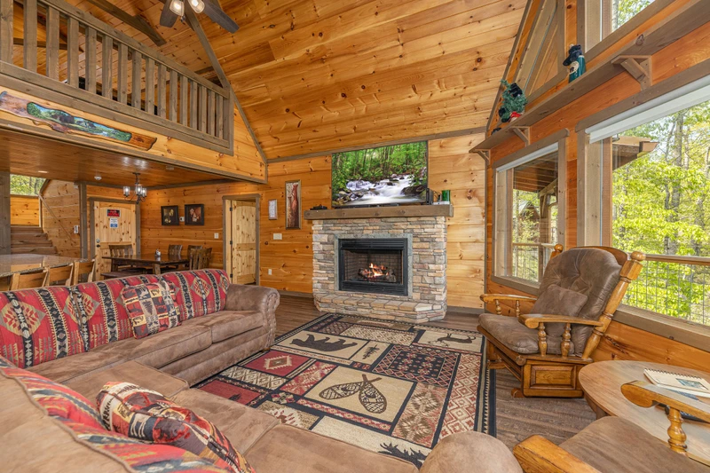 Enjoy the open Smoky Mountain cabin feel from this spacious seating area.