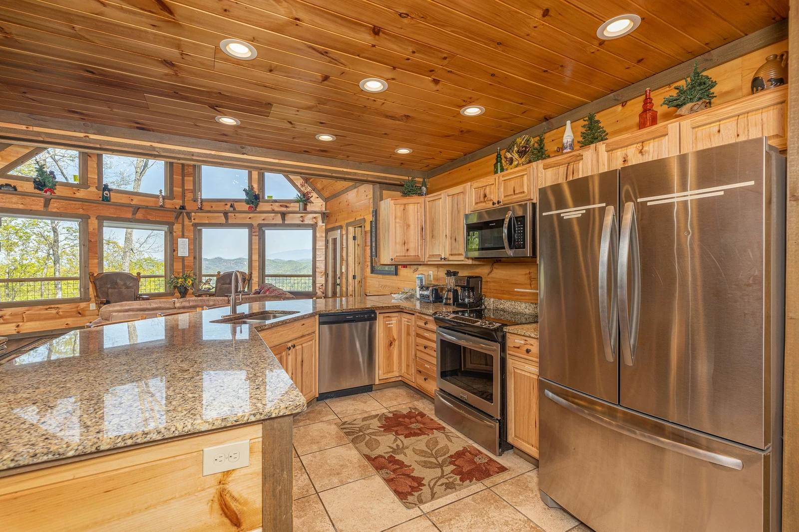 Fully equipped rental cabin kitchen with stainless steel appliances and lots of counter space.