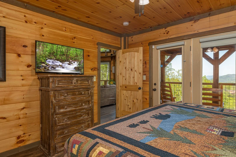 Enjoy  Smoky Mountain views and television from your master bedroom.