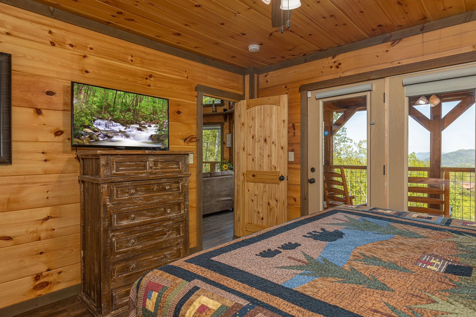 Enjoy  Smoky Mountain views and television from your master bedroom.
