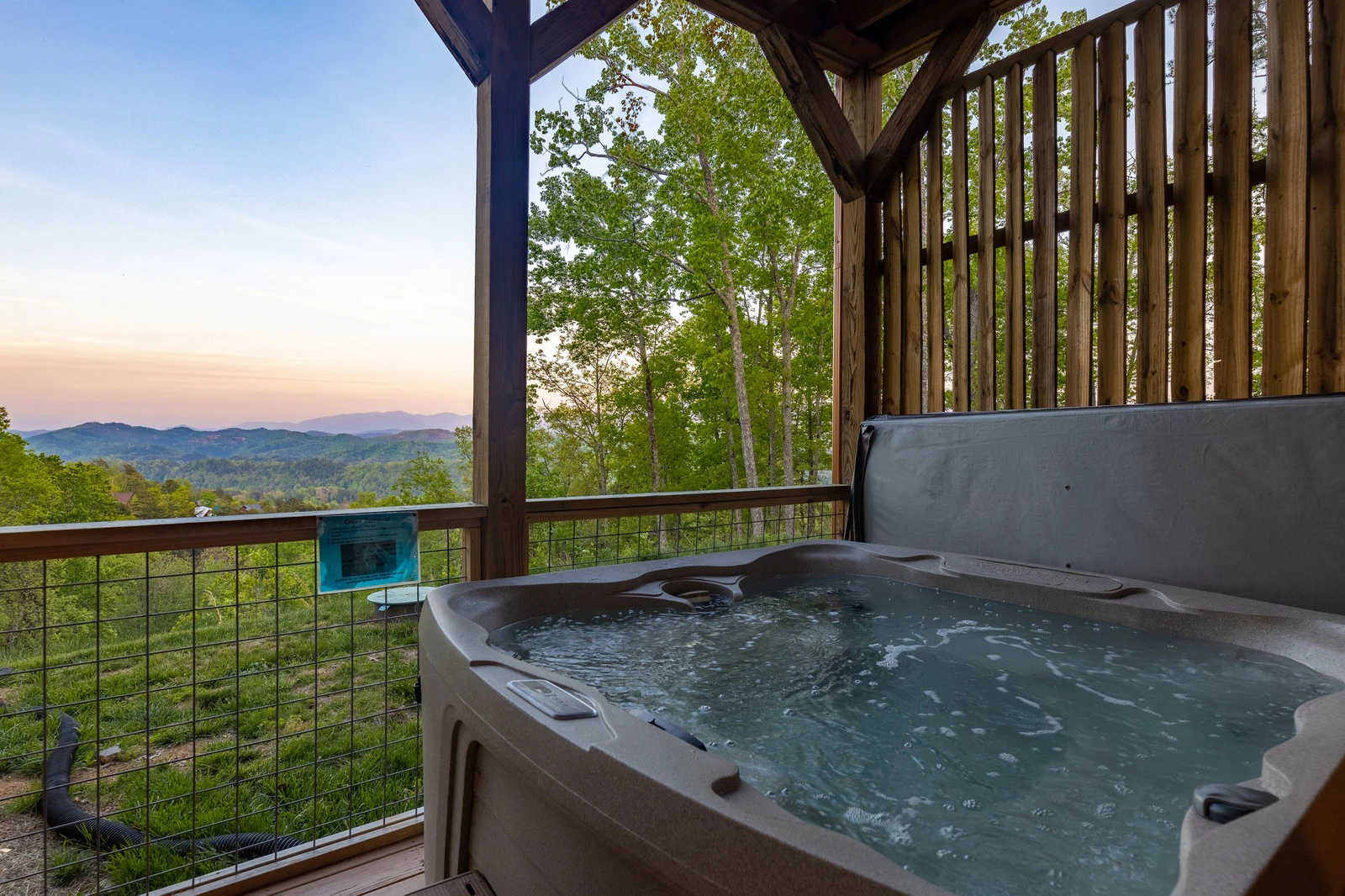 Large hot tub with scenic views of the Smoky Mountains.