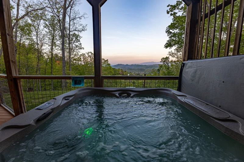 Watch the sunset from your rental cabin's hot tub.