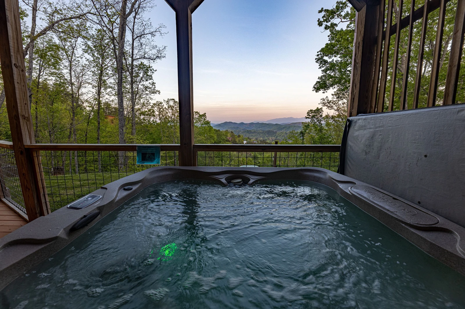 Watch the sunset from your rental cabin's hot tub.