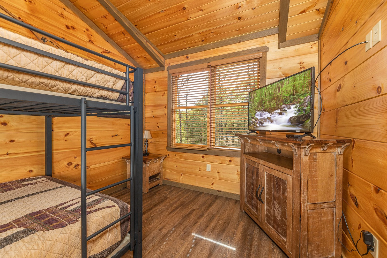 Bunk bedroom with television.