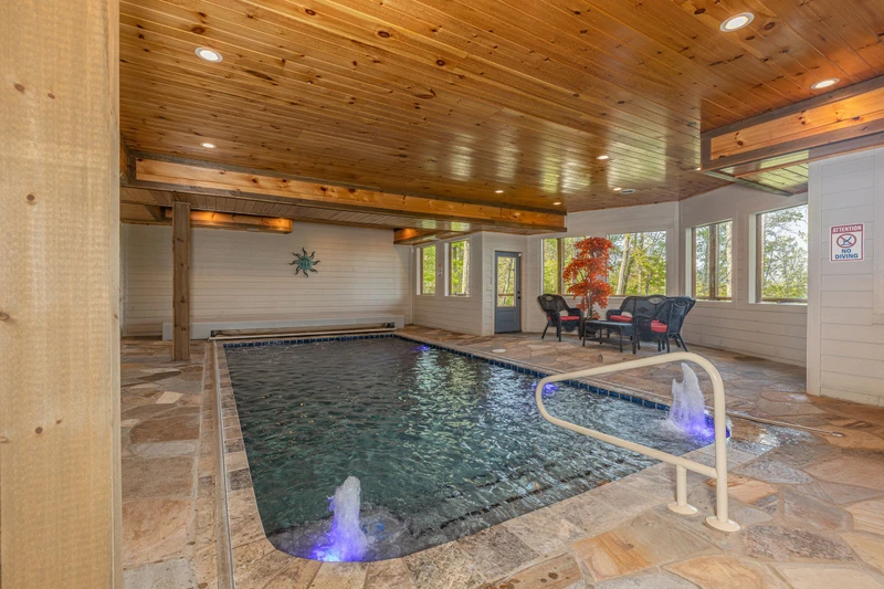 Cabin's swimming pool has unique water spouts.