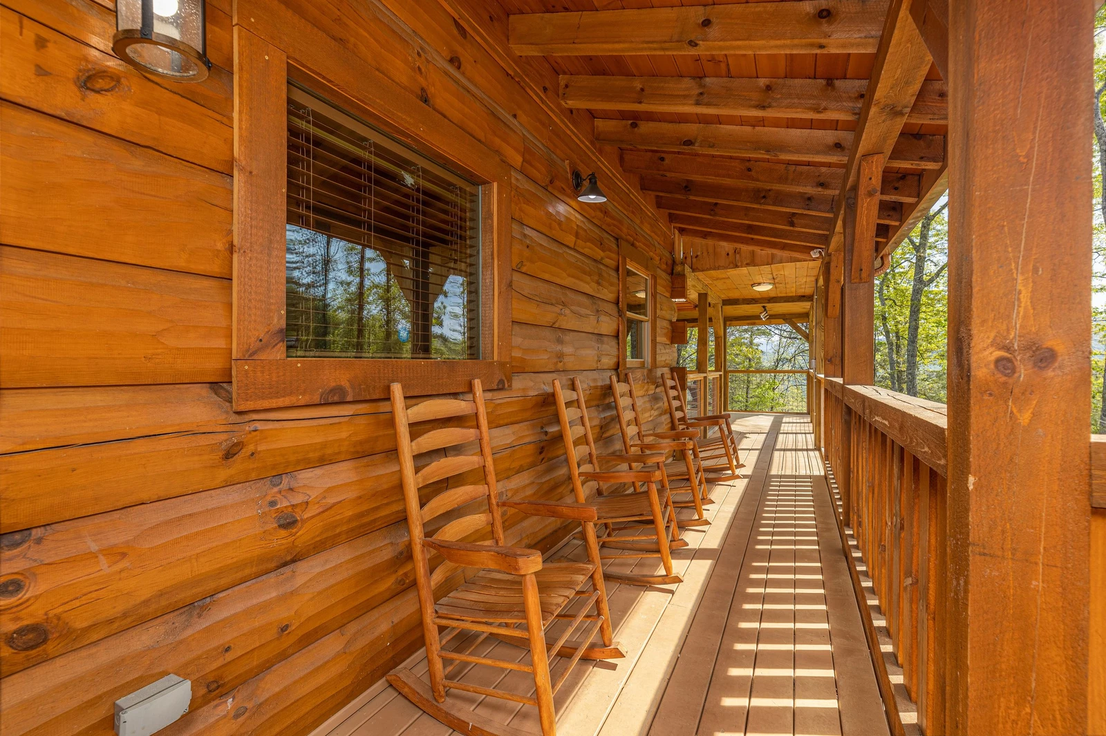 Your rental cabin has plenty of rockers for relaxing in the shade.