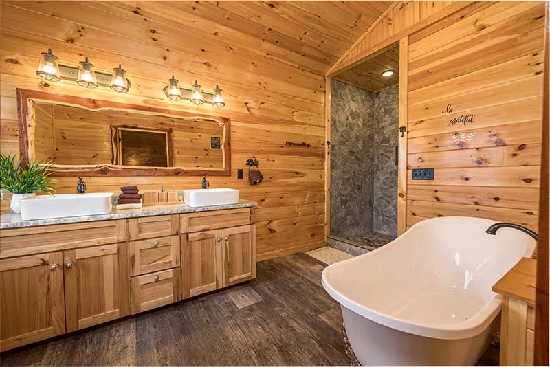 Your rental cabin's master bath with clawfoot bathtub.