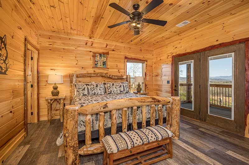 Smokies cabin's second bedroom with log bed.