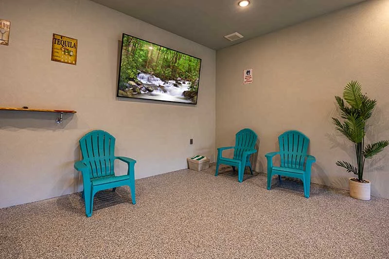 Seating around the cabin's swimming pool.