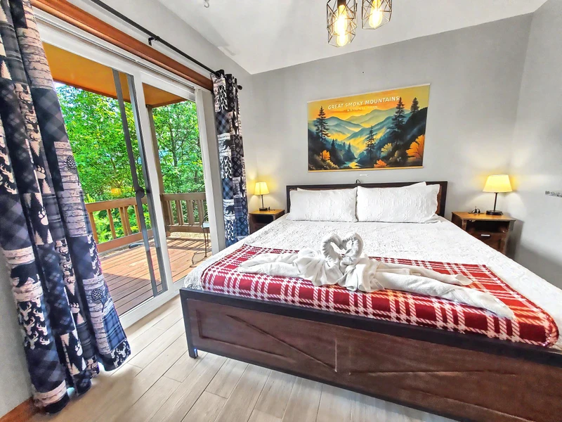 King size bed overlooking the mountains by the main living area