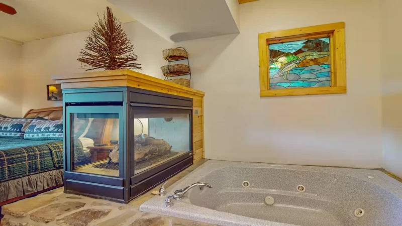 King Suite #2 with its own fireplace beside the jacuzzi tub.