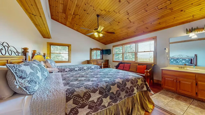 Fourth bedroom with flat screen television.
