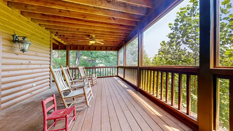 Spacious cabin porch with plenty of rockers for family and friends.