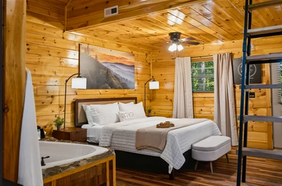 Luxurious king bed with treetop views — a serene, romantic haven for two.