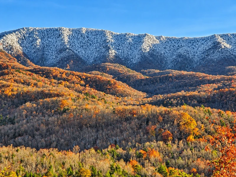 Zoomed view of the snow-capped mountains in mid-November from the 30 foot covered deck at Gatlinburg Landing