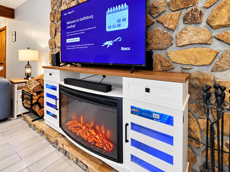 Electric fireplace and 55 inch Roku Smart TV.