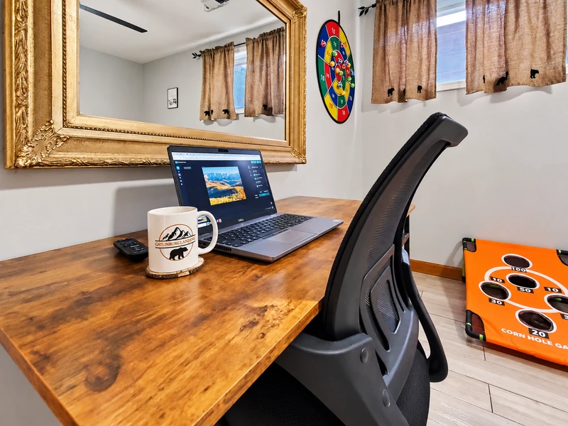 Work Desk in the game room with a rolling chair
