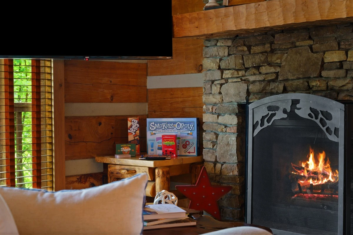 Stone gas fireplace at Nestled Oaks
